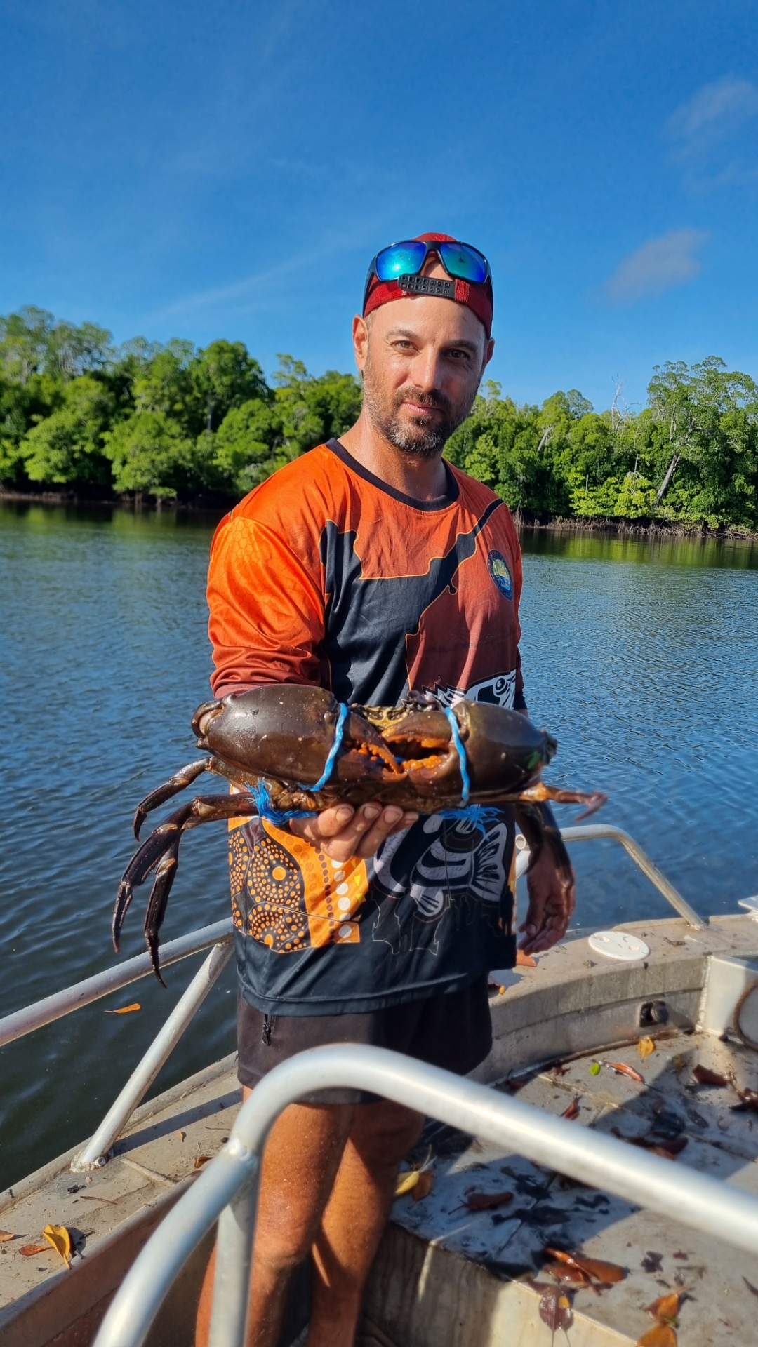 Mud crab held on a boat